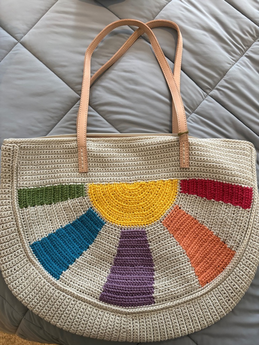 The Sak Crochet Half-Moon Tote in Beige with Multicolor Sunburst